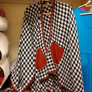 Houndstooth cape with red leatherette trim and poc